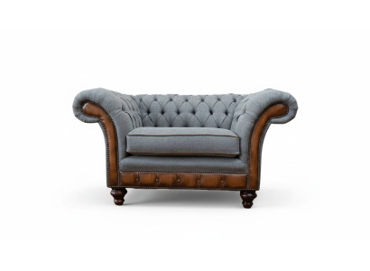 Poltrona design relax in tessuto lounge di lusso grigia imbottita Chesterfield.