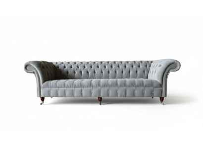 Divano Chesterfield Design a 4 posti in tessuto di lusso.