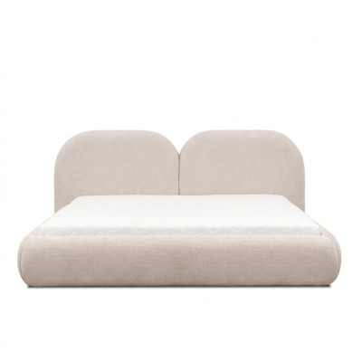 Camera da letto beige con letto matrimoniale, testiera rotonda in tessuto, letti imbottiti nuovi.