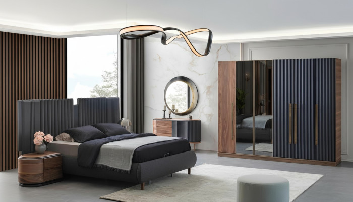 Set da camera da letto nero-beige con letto matrimoniale di design e 2 comodini.
