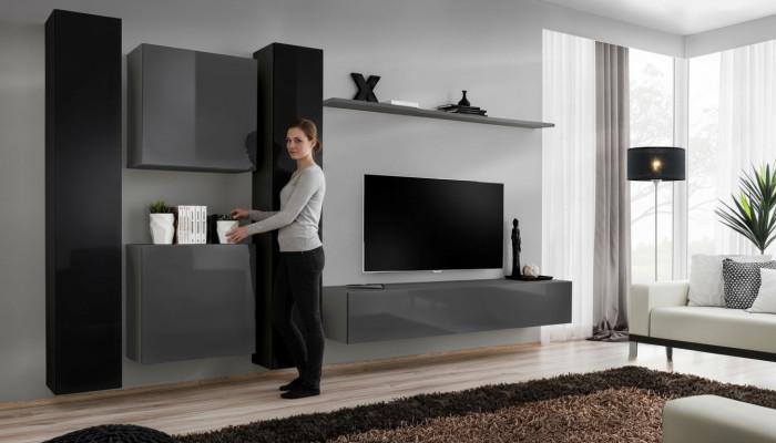 Mobile soggiorno grigio in stile design con 4 armadi a parete e scaffale a muro completo.