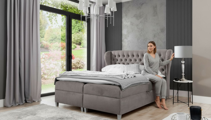 Letto boxspring Chesterfield di lusso, arredamento moderno della camera da letto.