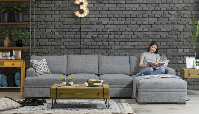 Divano ad angolo a L moderno grigio stile soggiorno divano design arredamento.