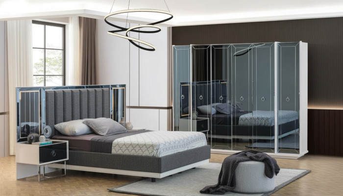 Set da camera da letto di design con letti matrimoniali comodini armadio.