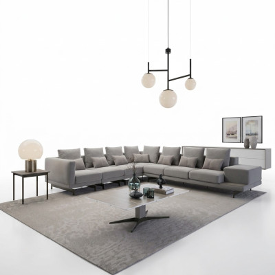 Divano design angolare a L in tessuto per il soggiorno con tavolino.