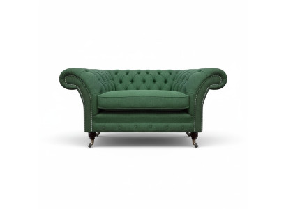 Elegante poltrona Chesterfield verde in tessuto per salotto, elegante monoposto.
