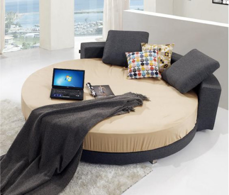 Letto rotondo nero con design moderno, dettagli eleganti e divano letto