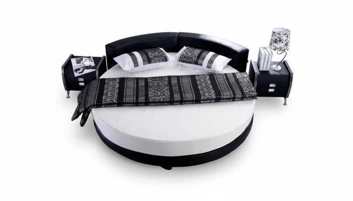 Letto rotondo nero con design moderno, dettagli eleganti e divano letto