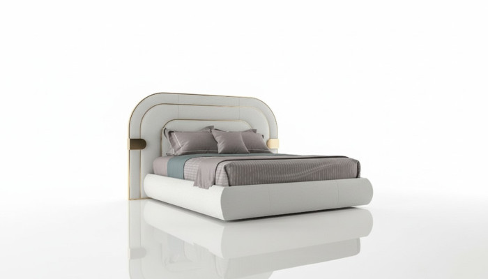 Letto grigio di lusso con accenti dorati design moderno e testiera imbottita