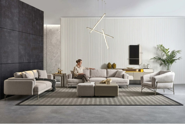 Set moderno per soggiorno con divani in tessuto beige, tavolini